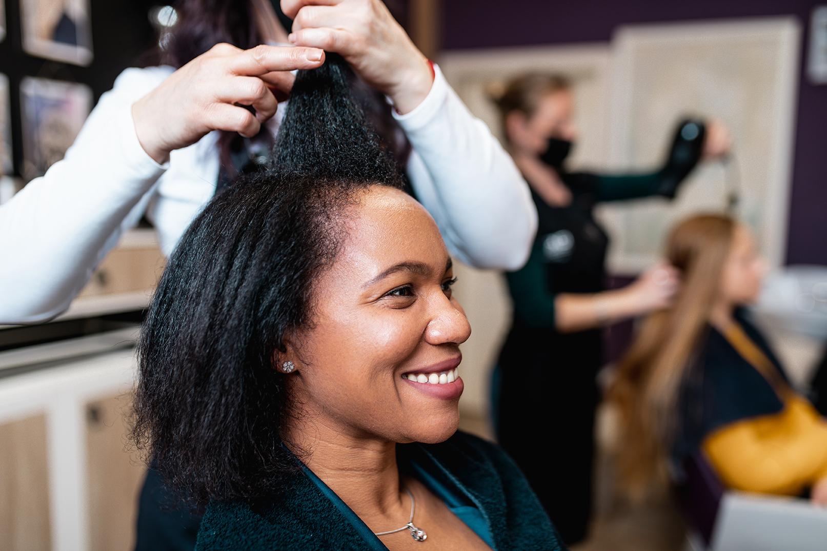 Image of a woman having her hair cut